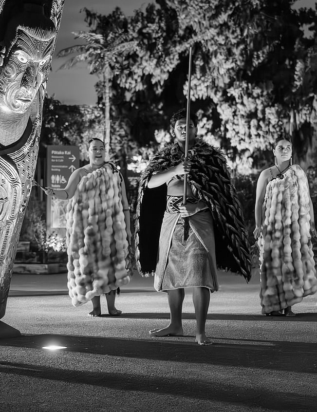Sports action photo of footballer taking a free kick into a wall of opposition players at a season game in Ohope, New Zealand.