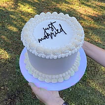 Gluten free child's birthday cake in red blue and yellow with the name Max and a figurine on top Roblox theme