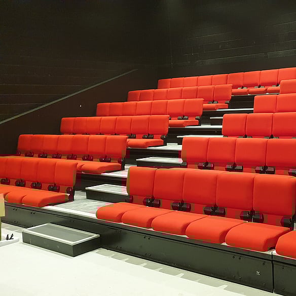 Covert Theatre - Retractable seating system with Merlot seat