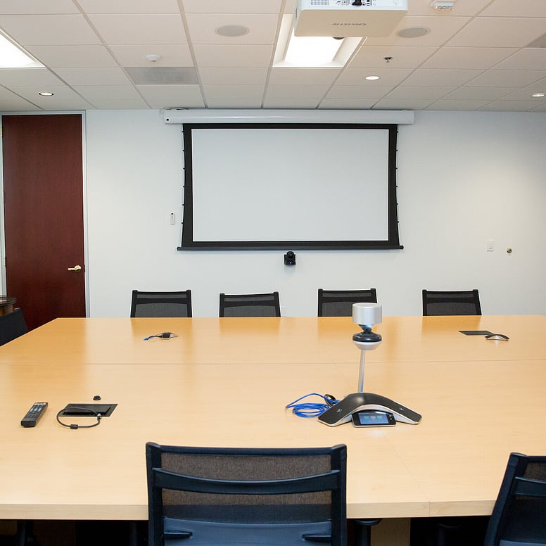 A boardroom with video conferencing system.