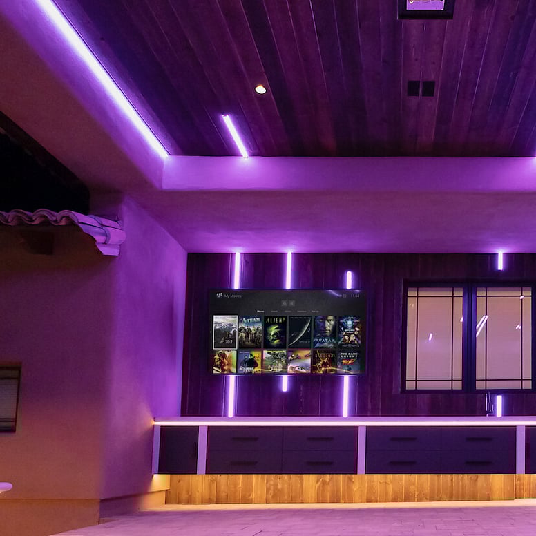 Clever lighting in an indoor space with a media screen.