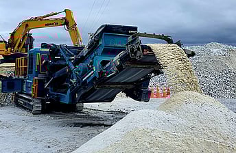 Powerscreen 260SR trackpactor crushing limestone in a quarry in New Zealand