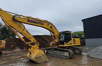 Heavy Duty Komatsu PC360-LC 36 ton excavator working at a concrete recycling yard in New Zealand
