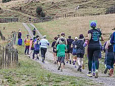 Trail runners, all together, smiles at blazing hills