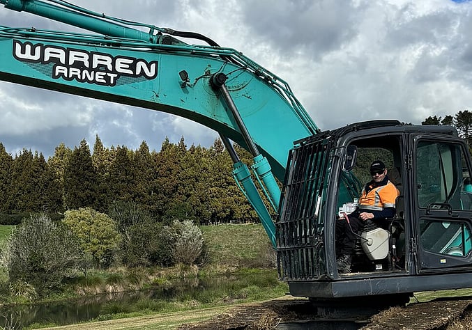 Large digger with owner operator inside.