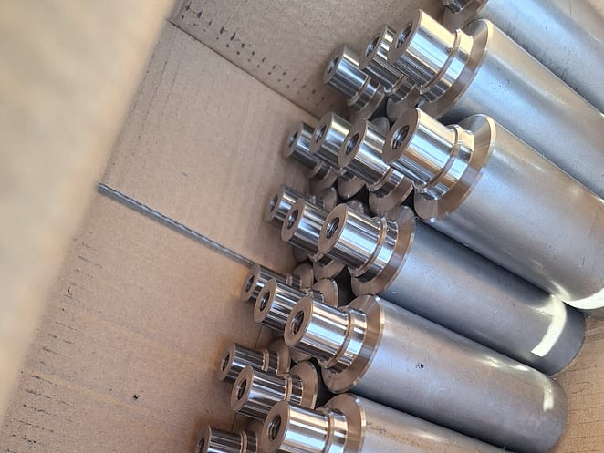 Close-up of machined aluminium component with sharp internal corners and stepped features.