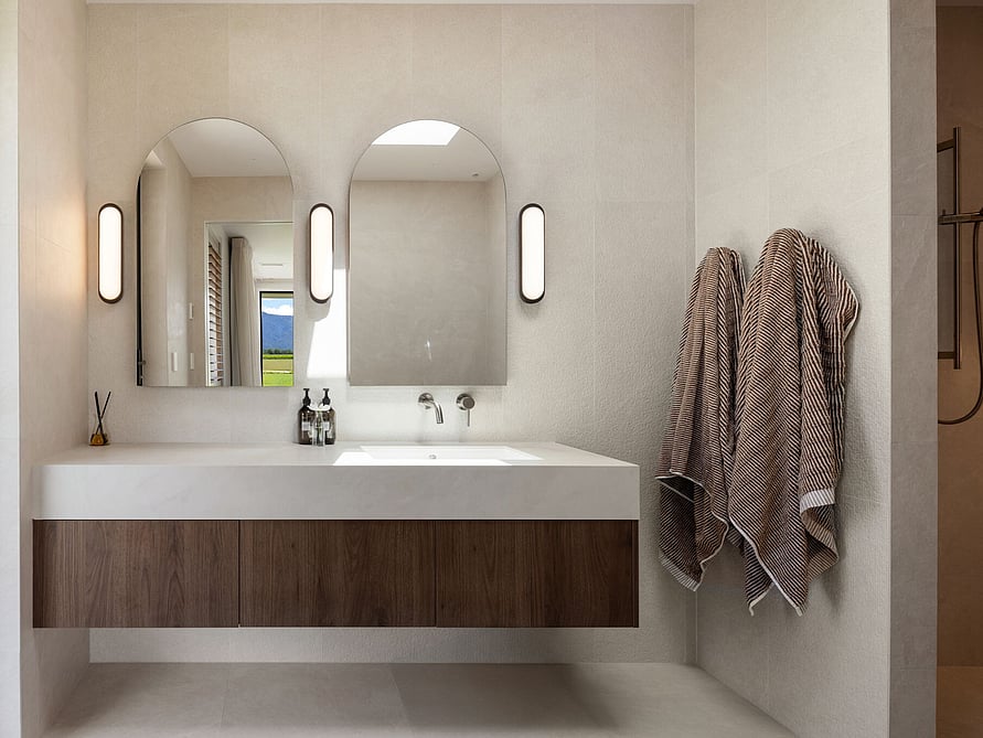 This architecturally designed floating bathroom sink creates a minimalist design, and natural tones are soothing and warm.