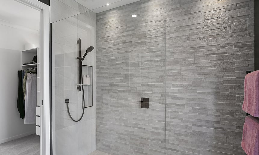 The glass shower faux wall, allows for the walk-in shower to fit perfectly in this small but luxurious ensuite bathroom.