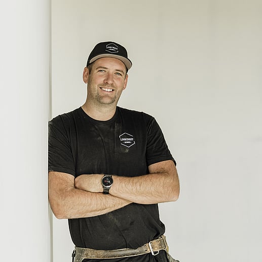 Luke Jones, head Builder and Owner of Linecrest Homes, smiling with his cap on and ready to build your new home in Cambridge.