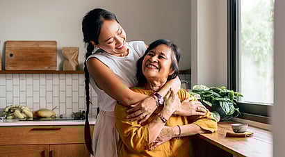 Father having fun teaching his son to ride a bike