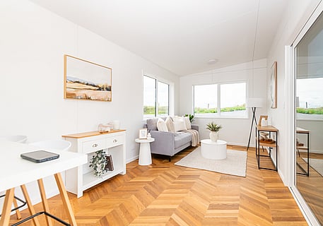 Wide angle shot of living room inside tiny home cabin