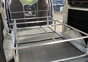 Sliding trays in work van