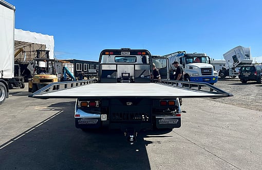 Rear view of Fuso Canter Salvage truck with custom fabricated slide deck
