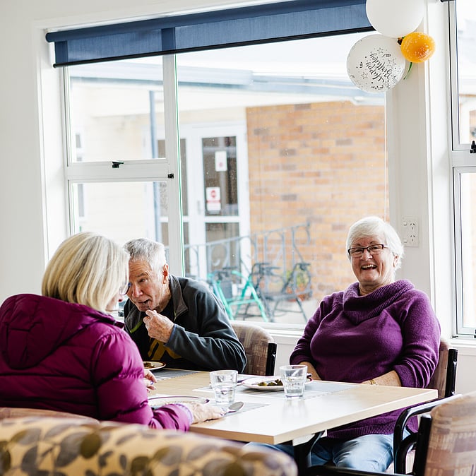 Residents enjoying a meal at Gymnasium at Assisi Residential Care