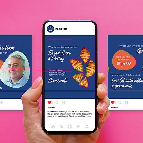 Hand with pink nails holding mobile phone displaying NZ Bakels social post about croissants, with additional post examples to the left and right, all on a bright pink background.