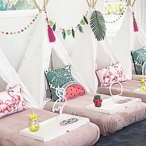 CLUB TROPICANA - Give your guests a taste of the Tropics with this Tropicana themed package.  Complete with watermelon pillows and greenery.