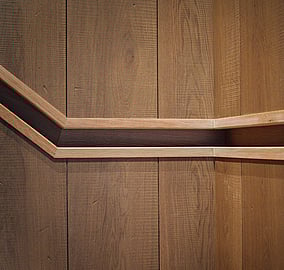 Staircase handrail detail with timber treads and a minimalist balustrade in the Ocean Beach Road architectural coastal home in Mount Maunganui, built by Tauranga architectural builders MB Construction.