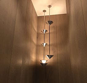 Stairwell with feature lighting washing over timber stair steps in the Ocean Beach Road architectural coastal home in Mount Maunganui, built by MB Construction.i