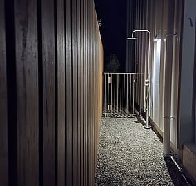 Outdoor beach shower at the Ocean Beach Road architectural home for rinsing off after a swim in Mount Maunganui, built by MB Construction.