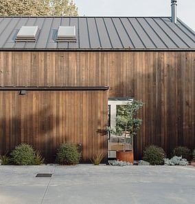 Barn-style architectural rural home near Matamata with full cedar-clad elevation, gabled roofline and rural outlook, built by MB Construction, residential builders for Matamata and the Bay of Plenty.