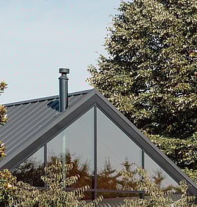 Barn-style architectural rural home near Matamata with cedar cladding and large glazed gable end facing the rural outlook, built by MB Construction, residential builders for Matamata and the Bay of Plenty