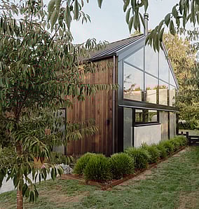 Barn-style architectural rural home near Matamata with cedar cladding, gabled end, landscaping and rural outlook, built by MB Construction, residential builders for Matamata and the Bay of Plenty.