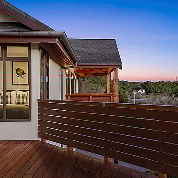 Home and deck with beautiful sunset.