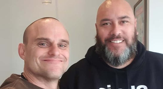 Sam Troth and supporter sharing a moment of unity and courage.