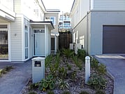 Multiple heat pump covers in garden. Wall hung