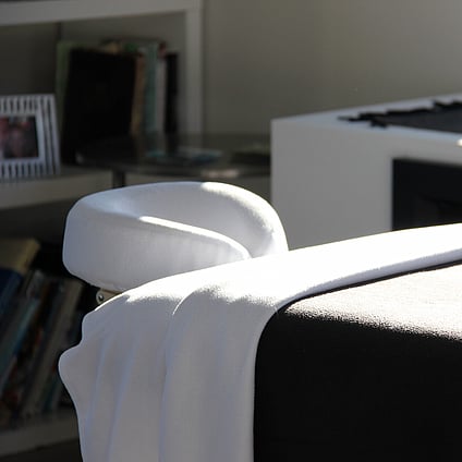 A massage bed all set up ready for a client to enjoy an Indulge massage.