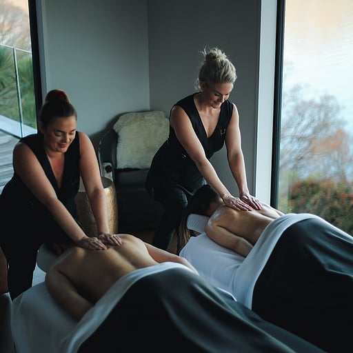A client receiving a gorgeous head massage during a facial treatment.