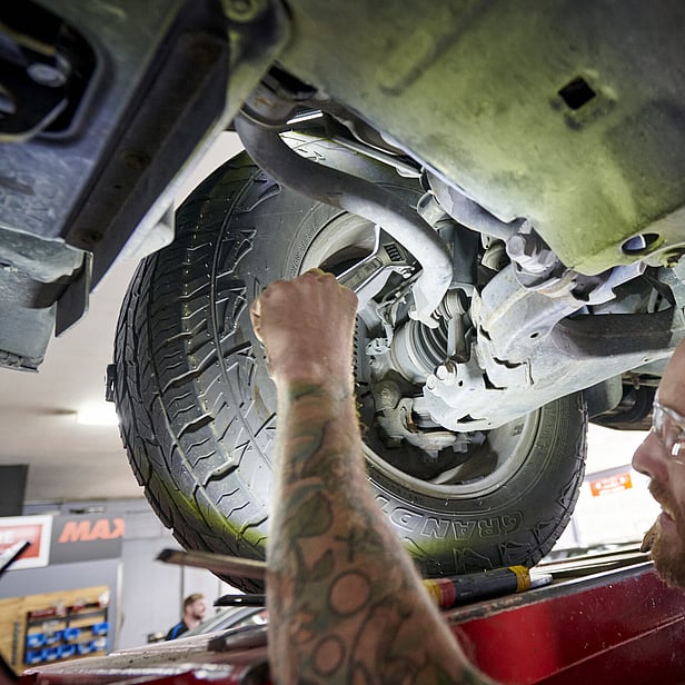 Cambridge Tyre & Alignment - Tighting up wheel under hoist