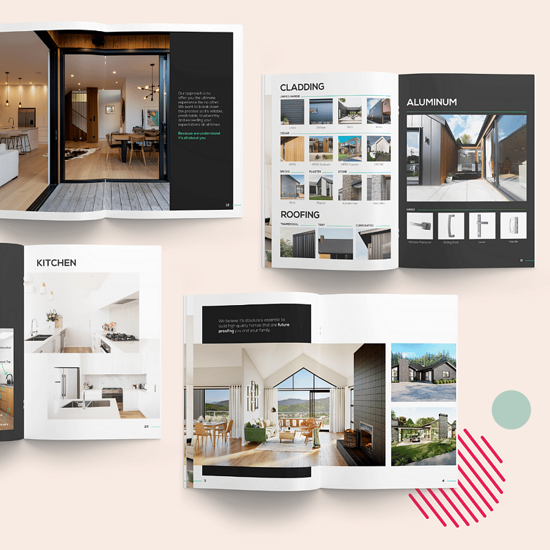 Open brochures showcasing modern kitchen, roofing, cladding, and aluminum designs with large images of stylish interiors and exteriors, placed on a soft pink background