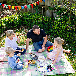 Editorial photography for Living Lightly book by Nicola Turner family outdoor picnic celebration