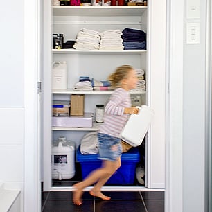 Editorial photography for Living Lightly book by Nicola Turner laundry linen cupboard bulk