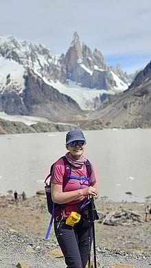 The author with a lake and mountains in the background.
