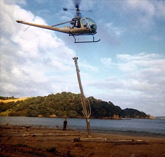 Smythe Contractors – Helicoptering power poles on islands