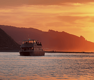 End the day with a sunset cruise aboard the Wahine Moe