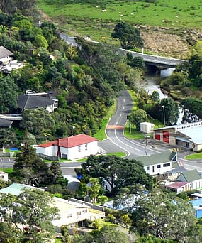 Aerial view of the Kuaotunu Hall and the Kuaotunu Fire Station and the junction with SH25 on the Coromandel Peninsula