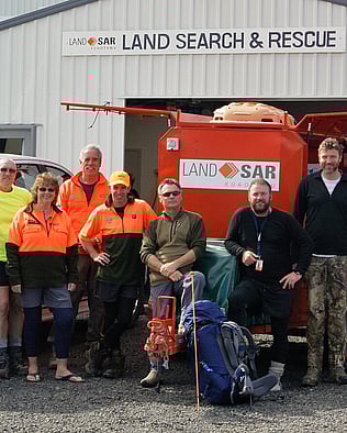 Kuaotunu LandSAR volunteers standing outside their base in Whitianga on the Coromandel Peninsula