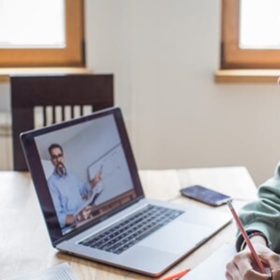 Young woman watching a Zoom lesson