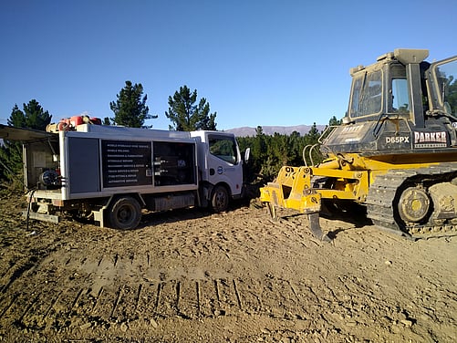 Komatsu D65 bulldozer receiving hydraulic repairs using our Ryco hose truck.