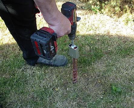 Inserting a ground anchor