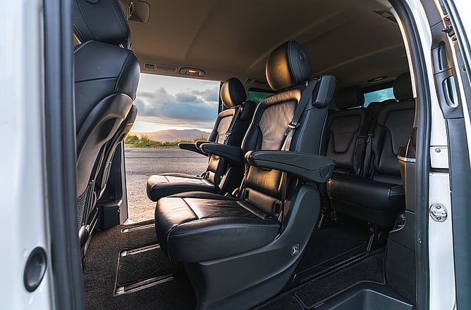 Luxury interior of an Exclusive Driver chauffeur vehicle with spacious leather seating