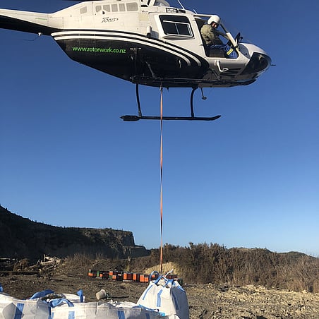 helicopter over truck on farm