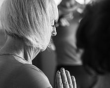 A women practicing Hatha Yoga in a class