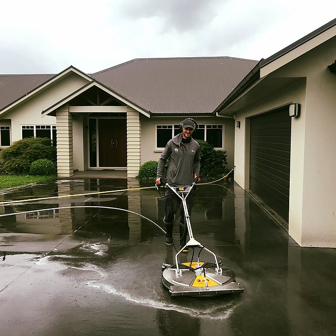Dry Gutts cleaning a driveway in Hamilton