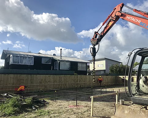Drilling holes for the piles on the new site. Due to the location of the house being close to the beach it was very important to ensure solid foundations. 