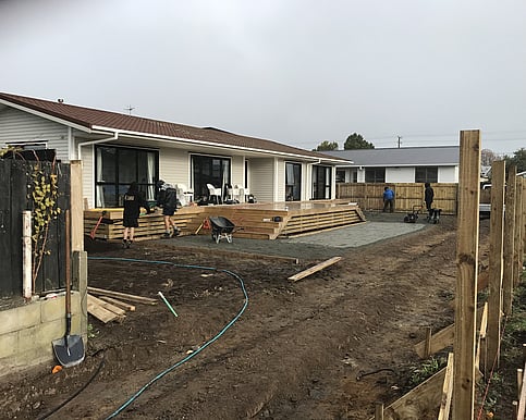 Decking is also added to the house, enhancing both its functionality and aesthetic appeal. nected and was wrapped in protective polyethylene, ready to be lifted and transported by the house moving company.