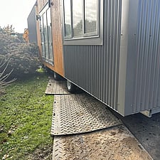 Tiny Towing Solutions use ground mats on wet sections